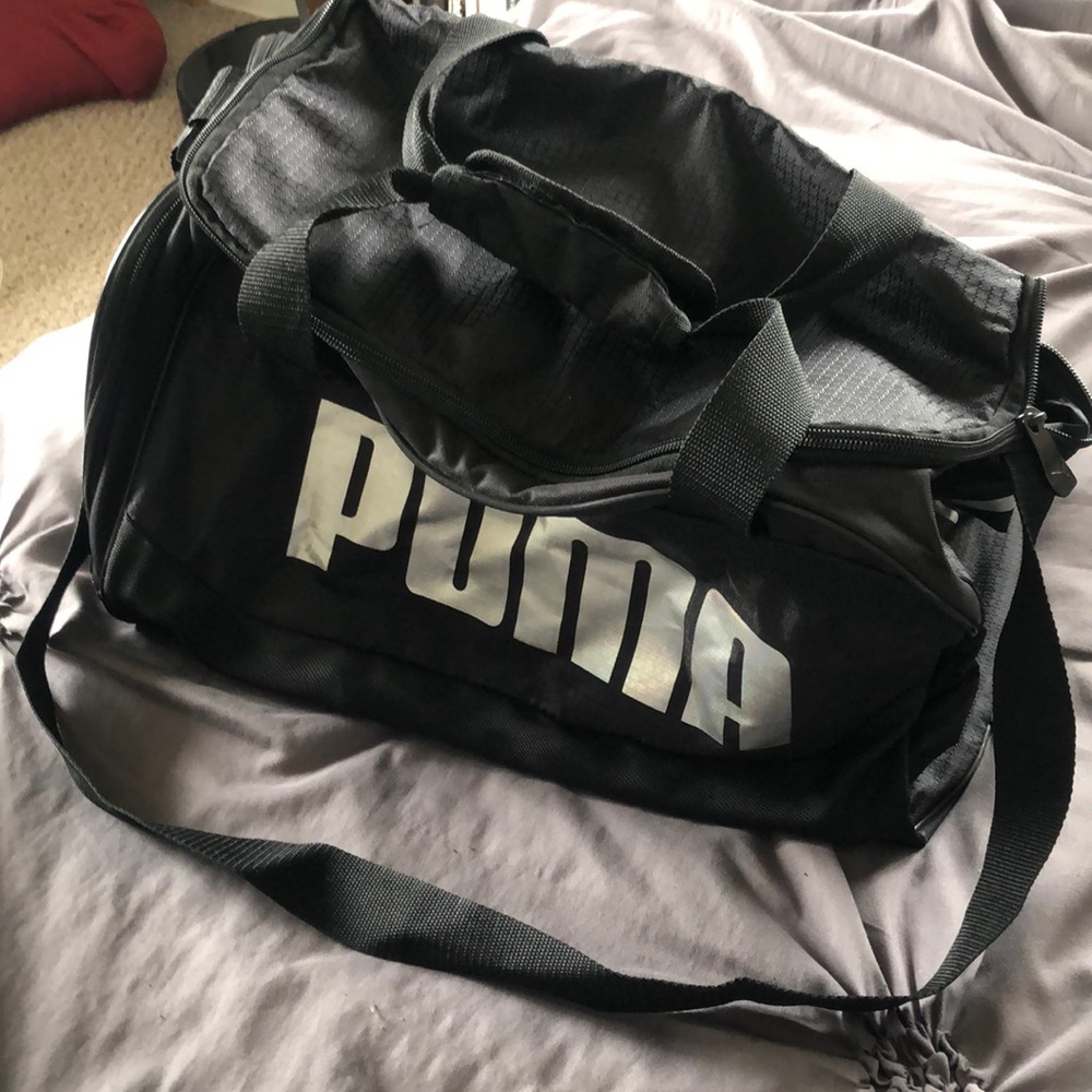 Black gym bag with silver Puma logos